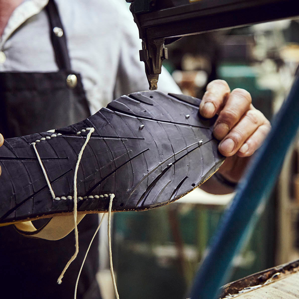 A craftsman holding the soul of the traditional Menorcan sandal, la avarca, made now out of old car tyres. 
